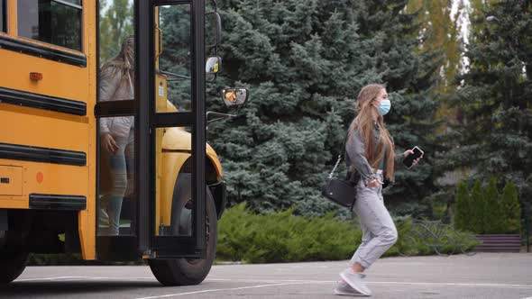 Diverse Pupils in Medical Masks Leaving School Bus