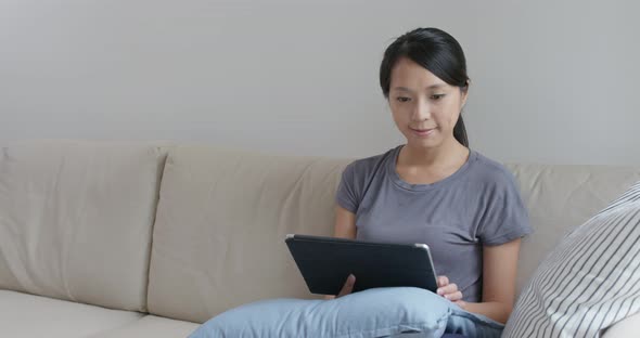 Woman use of tablet computer at home