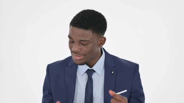 Disappointed African Businessman Reacting Loss on White Background