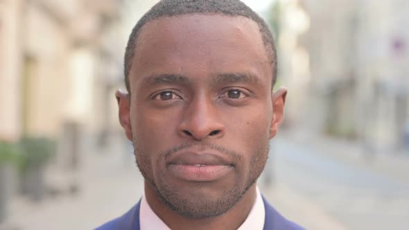 Outdoor Close Up of African Businessman Face