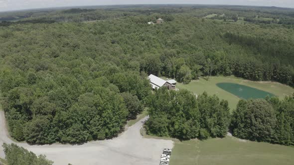 Aerial View Big House in the Forest Against the Backdrop of a Cloudy Sky