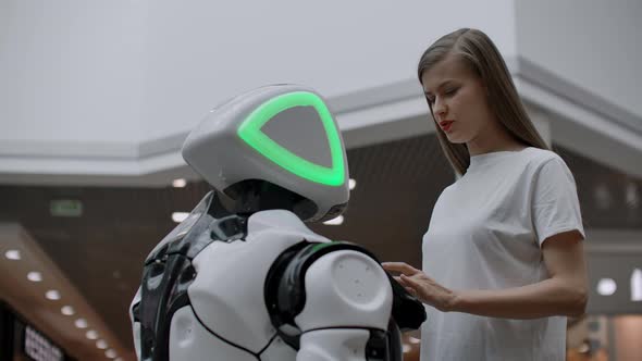 A Female Programmer Tests the Robot for the Ability to Interact with Users