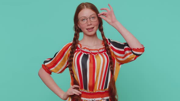 Cheerful Lovely Ginger Young Girl Fashion Model in Colorful Dress Smiling Looking at Camera Alone