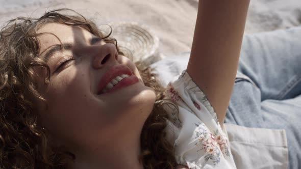 Carefree Woman Smiling Lying on Boyfriend Chest Closeup