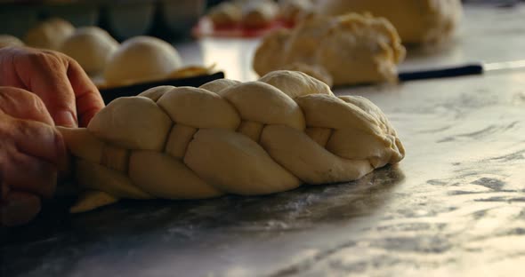 Chef forming the layers of croissant dough 4k