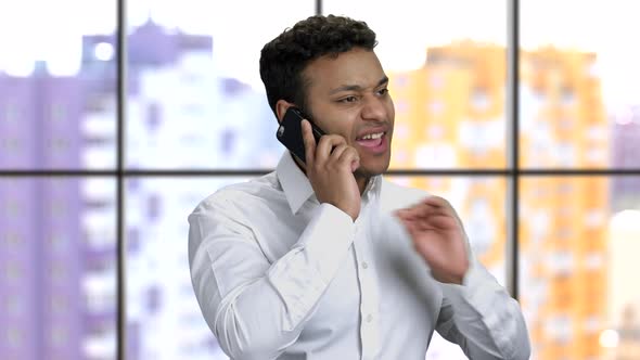 Confident Businessman Talking on Cell Phone