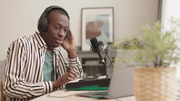African Man Making Electronic Music