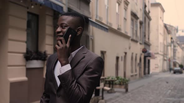 African Businessman Having Mobile Conversation