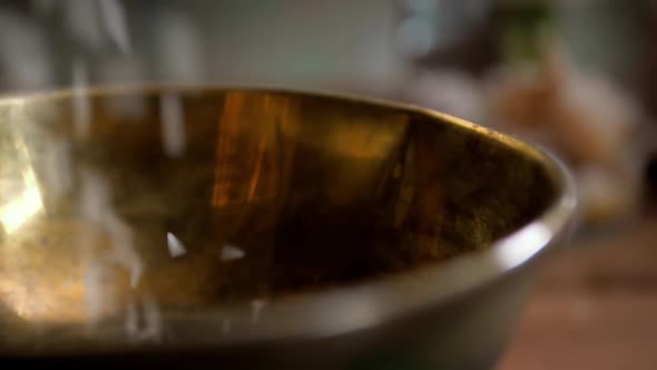 Dry Basmati Rice Fall in Wood Gold Metal Bowl on Table From Hands Woman Slow Motion Close Up Macro