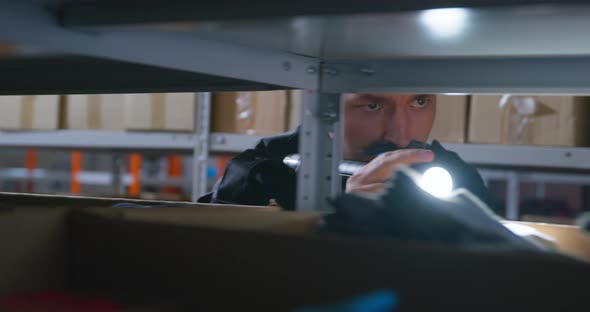 Man with Moustache Acts Like Thief and Walks Past Shelves