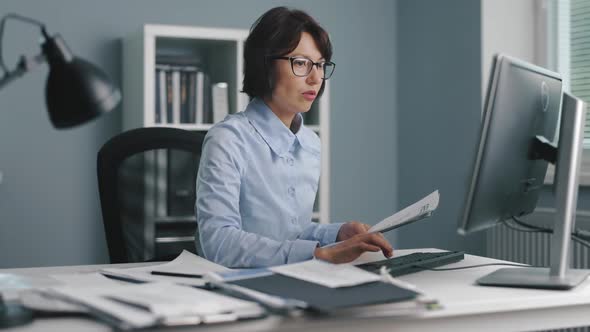 Irritated Woman Working at Office