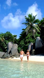 Anse Takamaka Beach Mahe Seychelles Tropical Beach with Palm Trees and a Blue Ocean Couple Man and