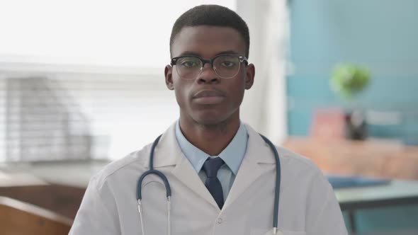 Young African Doctor Smiling at Camera