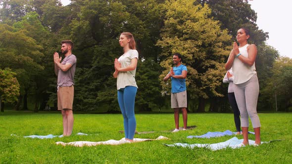 Group of People Doing Yoga at Summer Park