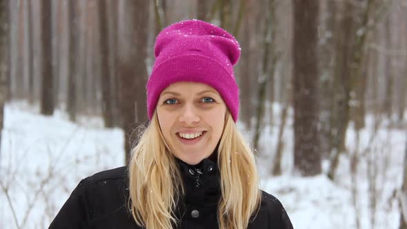 Woman Plays With a Snow