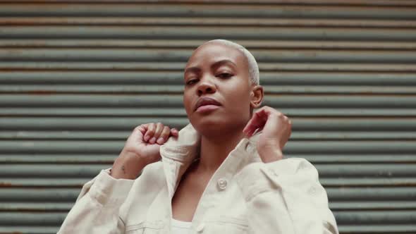 Slow motion shot of proud woman wearing denim jacket