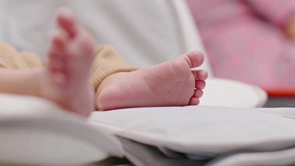 Close up barefoot of newborn baby lying on baby bed relax and comfortable