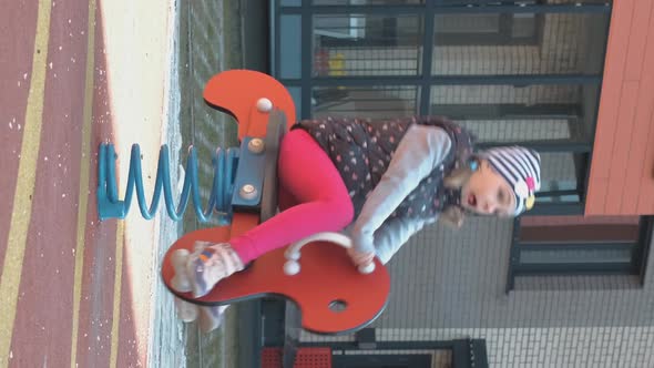 Cute Little Girl Enjoying Playing Outdoors