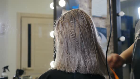 Woman Getting Her Haircut Done