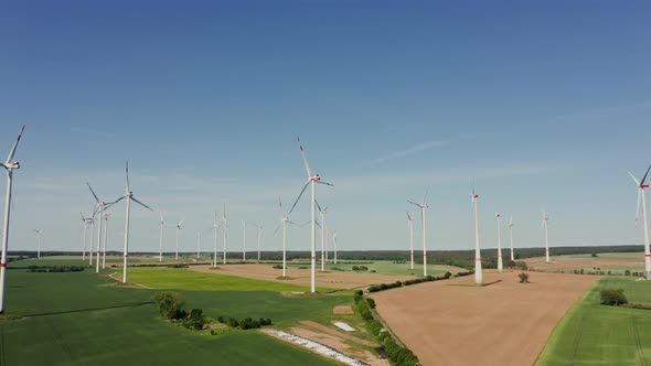 A Drone Shot of a Massive Wind Farm in Agricultural Land