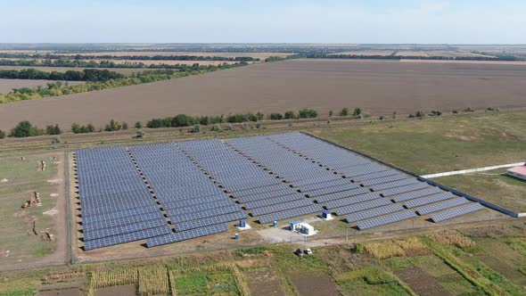 Stunning Aerial View of a Field with a Solar Power Station Modern Technology