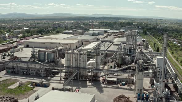 Aerial Drone View. Factory Industrial Zone, Wood Processing Factory Warehouses, Workers Inside the