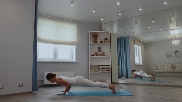 Young Woman Practicing Yoga in Studio