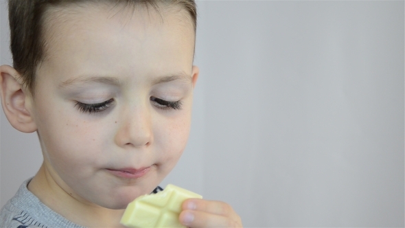 Child Eating White Chocolate 01