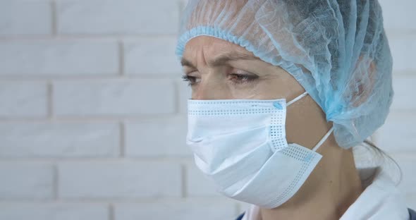 Nurse in Medical Mask and Hat