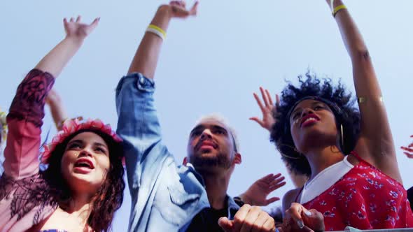 Group of friends dancing at music festival 4k