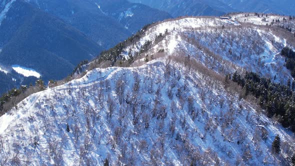 Winter drone flight over Mestia`s mountains in gerorgia. Hatsvali Ski Resort next to Uschba and Tet