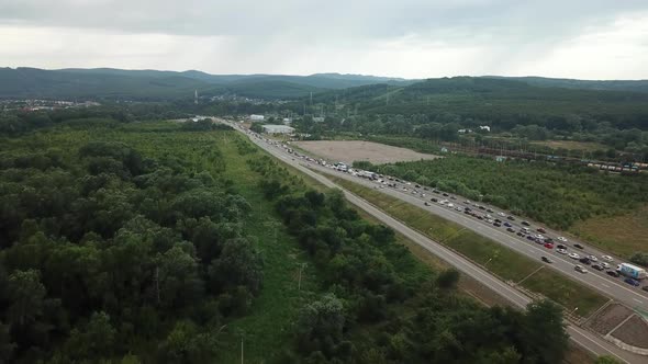 Drone Point of View - Traffic at Peak Hour with Cars on the Road, Over the Bridge