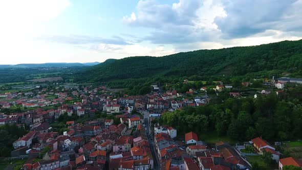 Drone flying above Volvic, toward the mountains.