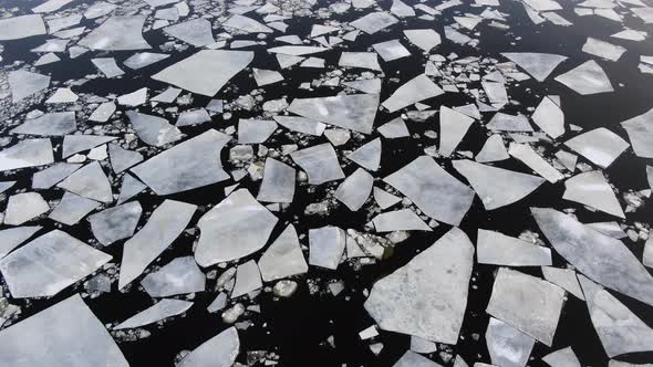 Big Floes Floating on Cold Water Surface of Sea in Winter