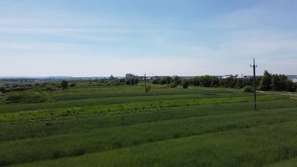 Aerial drone view of a flying over the rural agricultural landscape.