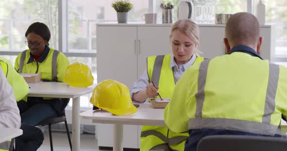 Diverse Engineers and Architects in Canteen Eating Lunch