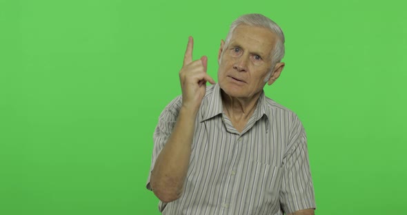 Senior Man Quarrels at Someone. Handsome Old Man on Chroma Key Background