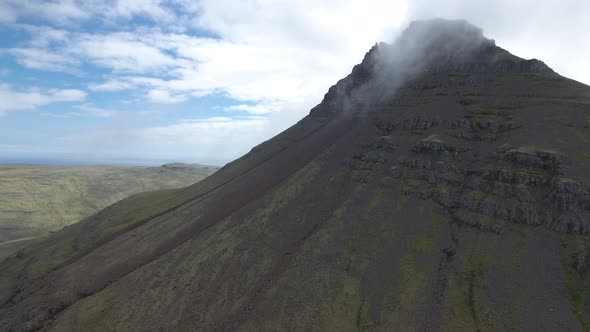 Beautiful landscape in Iceland - a mountain with its top in the cloud