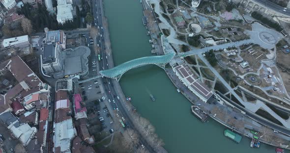 Aerial view of Tbilisi city central park and Bridge of Peace. Beautiful cityscape of old Tbilisi