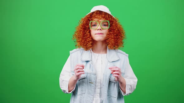 Young Cute Redhead Curly Woman Wearing Panama Hat and Eyeglasses Looking at Camera and Celebrating