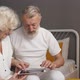 Elderly Caucasian Man and Woman Play Online Games Look at the Screen - VideoHive Item for Sale