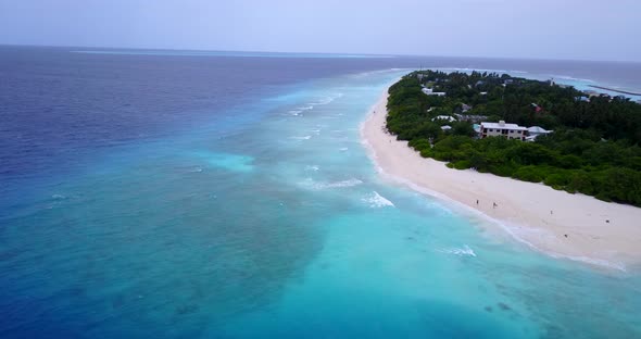 Wide angle drone copy space shot of a summer white paradise sand beach and aqua blue ocean backgroun