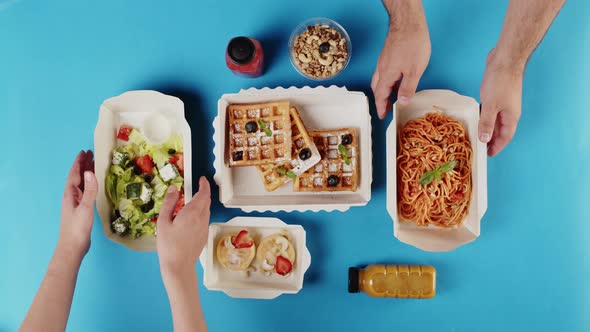 Food Delivery Top View Take Away Meals in Disposable Containers on Blue Background
