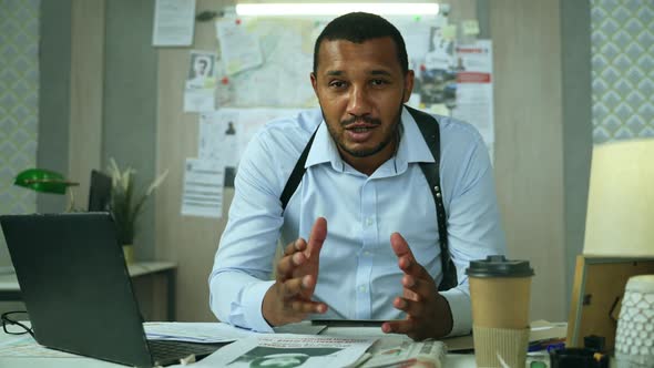 African American Detective Talking to the Camera