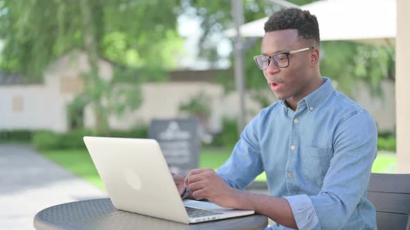 African Man Talking on Video Call on Laptop