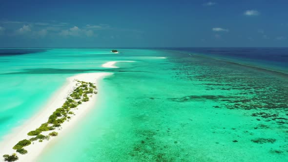 Aerial view panorama of beautiful resort beach voyage by aqua blue ocean and white sandy background 