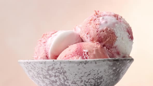 close up of three pink fruit ice cream balls