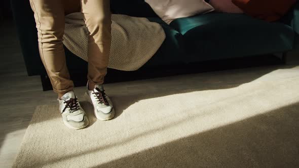 Closeup of Young Sportsman Legs Minting a Soccer Ball Professional Football Player Training in the