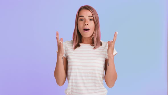 Woman with Pink Hair and Tattooed Hands Dressed in Striped Tshirt