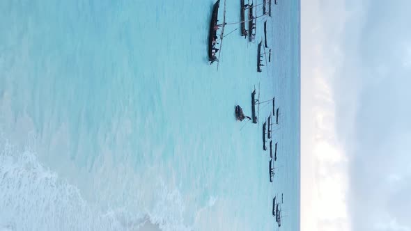 Vertical Video Boats in the Ocean Near the Coast of Zanzibar Tanzania Aerial View